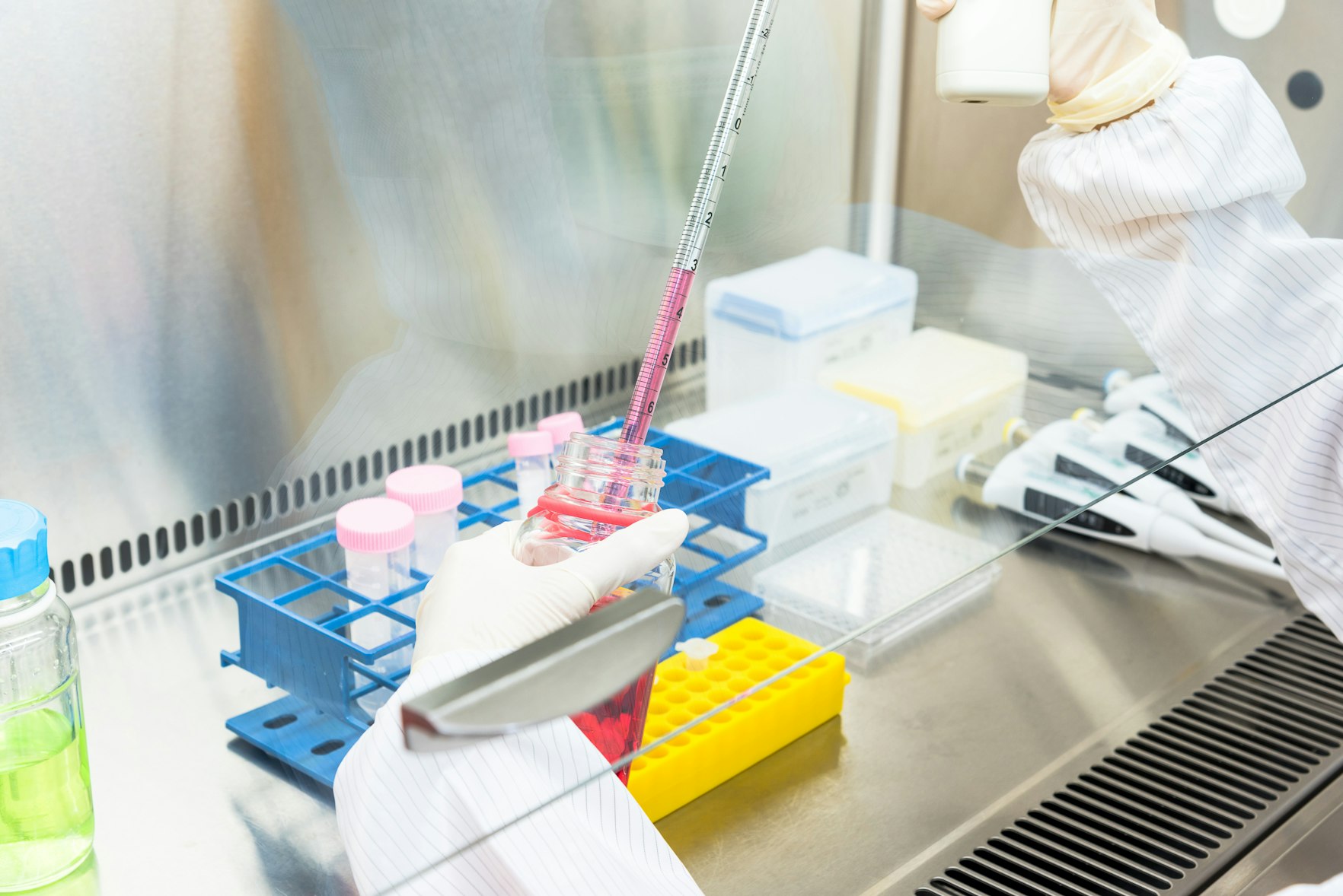 A scientist doing research in cleanroom facility