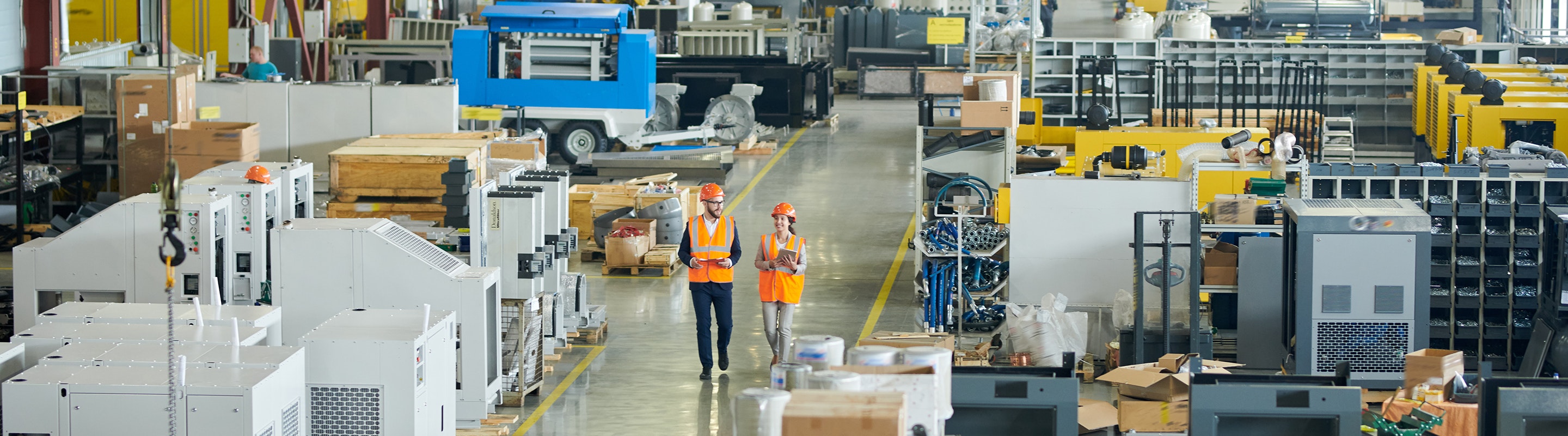People walking through factory