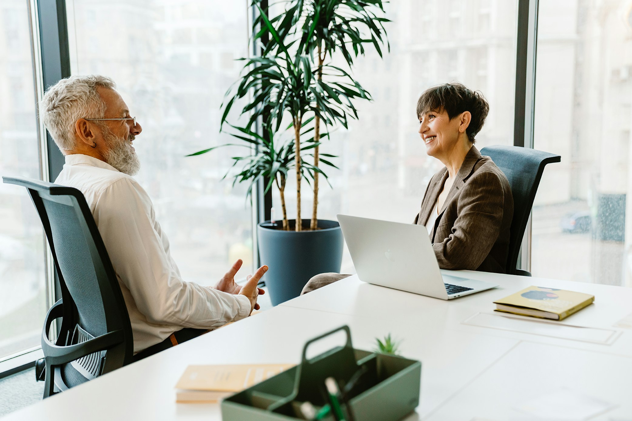 People laughing in meeting services startup assistance