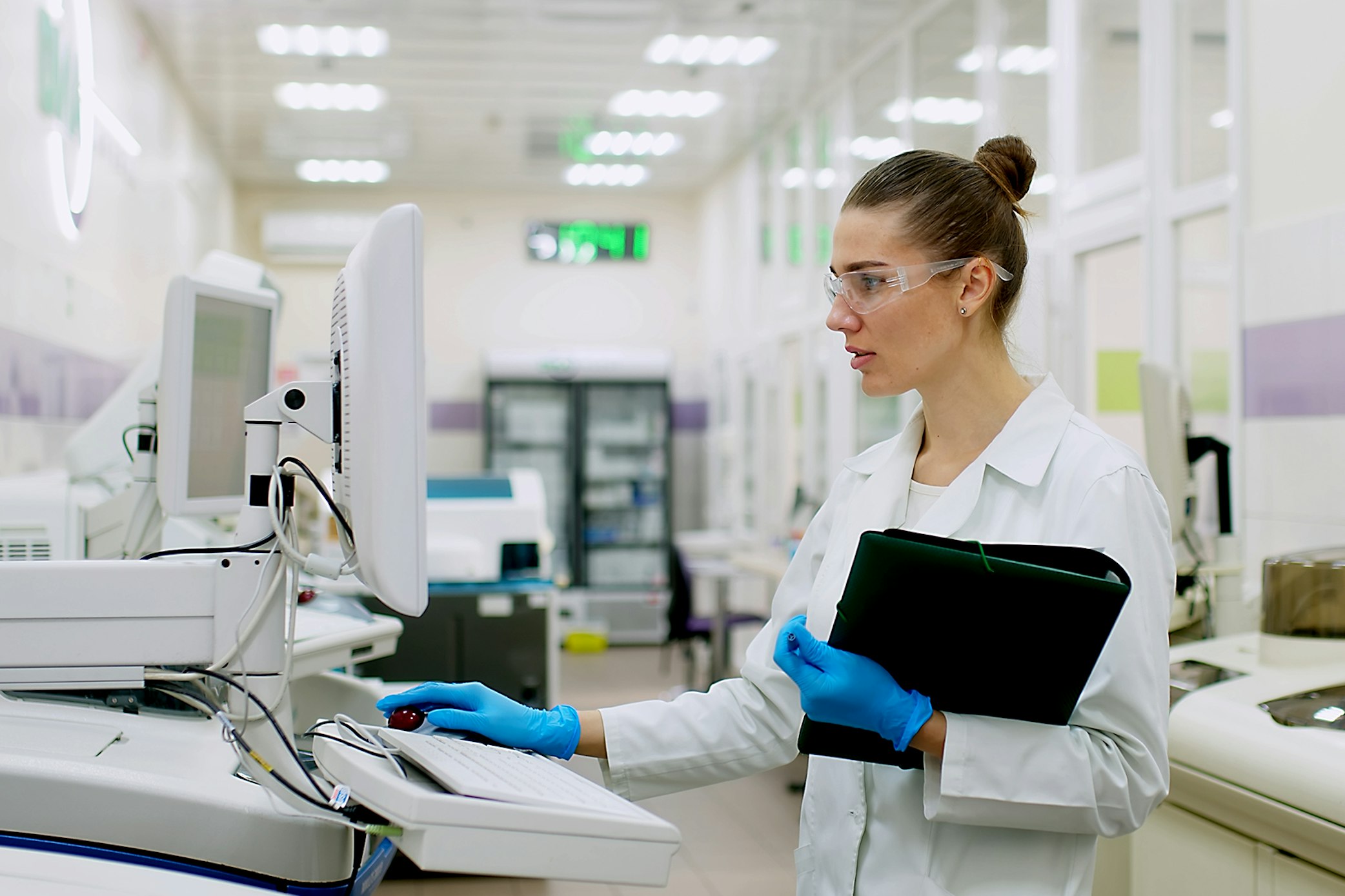 Woman working in lab at computer services startup assistance